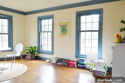 Front window wall in a home office, illustrating how low windows can complicate furniture placement.