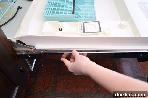 Give Your Dishwasher a Color Makeover 4 Removing the trim piece from the dishwasher