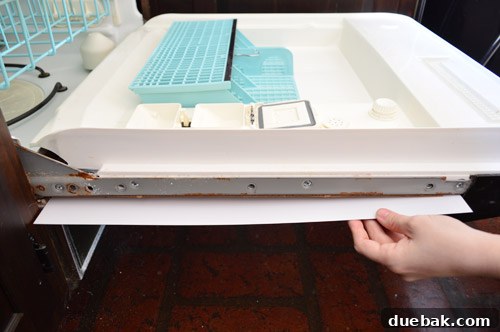 Give Your Dishwasher a Color Makeover 5 The removable panel from the dishwasher, showing a white side