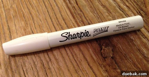 Oil-based Sharpie paint pen and a respirator for safety