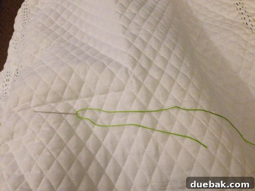 Hand threading an embroidery needle with a single strand of floss