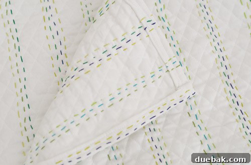 Back view of the finished quilt showing neat hemming and stitching
