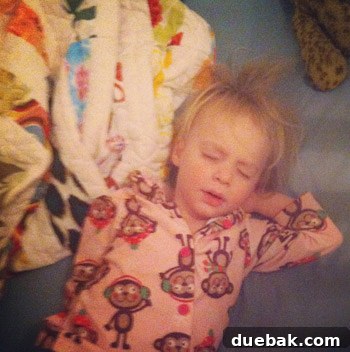 Clara holding her quilt, a beloved item for sleep and travel