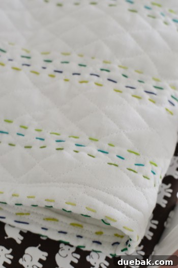 Fabric laid out, showing initial lines of embroidery floss
