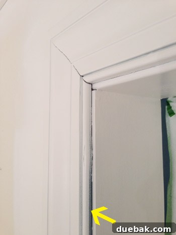 Close-up of trim after first coat, showing missed spots
