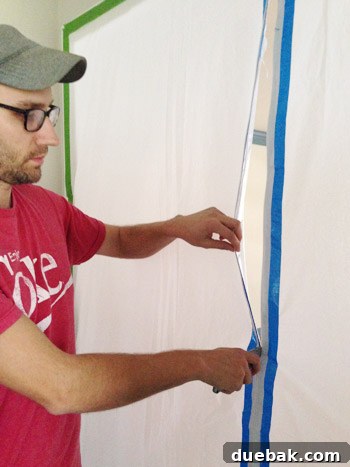 Tarp with zipper creating a paint zone