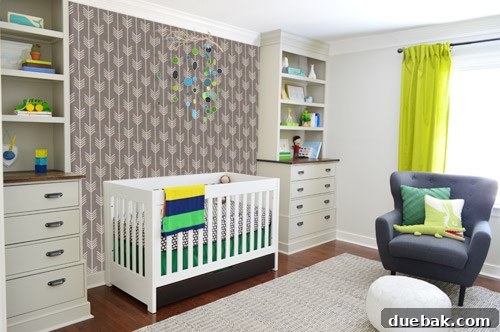 A Photoshop mock-up showing the light patterned wallpaper on the crib wall of the nursery, with built-ins and mobile, for comparison.