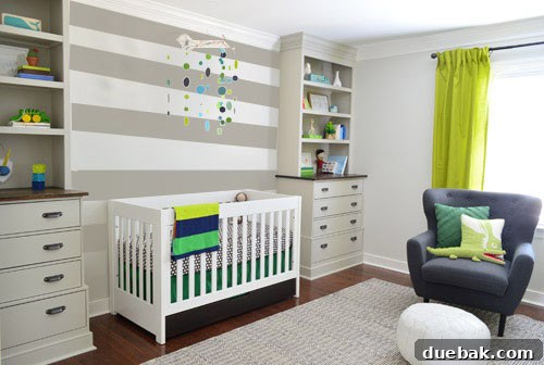 A reader-submitted Photoshop mock-up featuring chunky painted stripes on the crib accent wall in the nursery, offering a bold design choice.