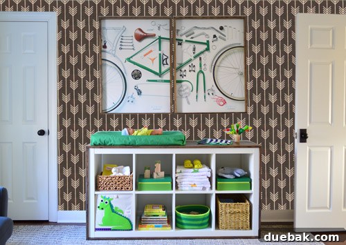 A Photoshop mock-up displaying the darker grey patterned wallpaper on the nursery wall, offering a visual comparison with the lighter option.