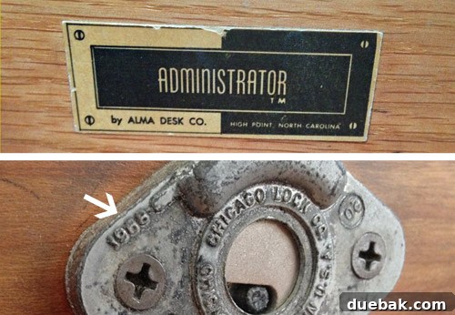 Close-up of the vintage desk's tag revealing 'Administrator TM' and a 1968 date.