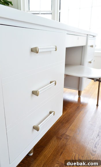 The newly painted desk showcasing its light and airy aesthetic within the office space.