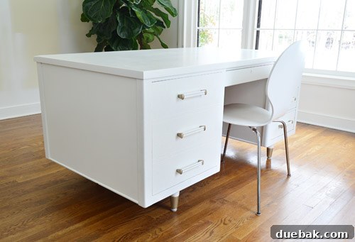 The office space with the freshly painted desk, providing a clean and inviting atmosphere.
