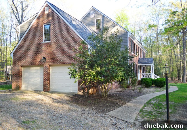 Listy VonListerstein: The Art of Intentional Listing 4 Garage exterior with a new light fixture and potential for further upgrades.