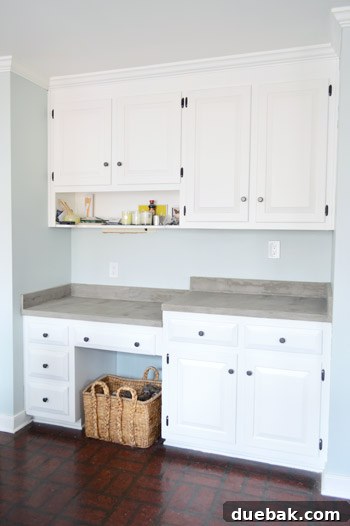 Updated kitchen with concrete countertops, focusing on overall aesthetic