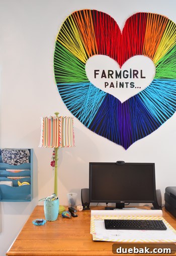 Farmgirl Paints string art sign creatively displayed above a desk, adding a unique and personalized touch to the home office craft room.