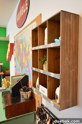 Small wood display shelf with numbered cubbies in a home office craft room, offering stylish and organized storage.