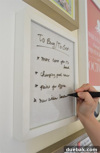Build Your Own Magnetic Display Board 16 The 'To Buy/To Get' list board, featuring a fabric background and using a marker on glass