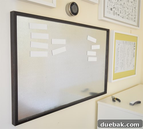 Build Your Own Magnetic Display Board 10 Testing the functionality of dry erase magnets on the newly installed magnetic board
