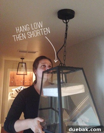 Light fixture temporarily hung low for easier wiring