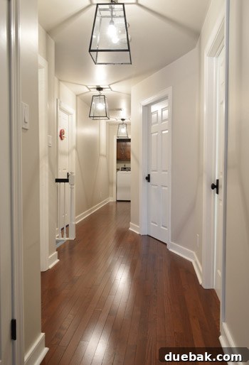 New hallway lights with clear bulbs casting shadows on the ceiling