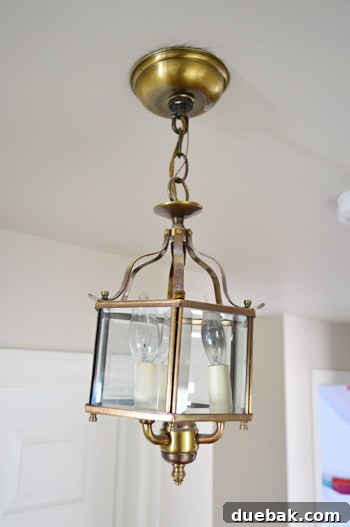 Close-up of the old, crooked, and mismatched light fixtures in the hallway