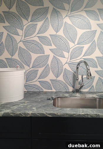 Showhouse Styling 11 Laundry room with Pebble Leaf wallpaper and dark wood cabinets