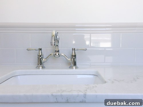 Showhouse Styling 14 Vintage-inspired bridge faucet in the guest bathroom