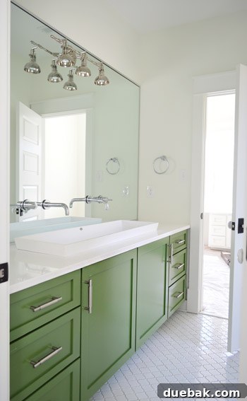 Showhouse Styling 16 Kids' bathroom with green vanity, wall-to-wall mirror, and industrial light