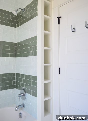 Showhouse Styling 19 Kids' bathroom shower with striped glass tiles and built-in wall shelves
