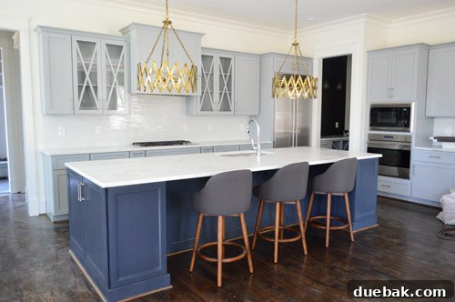 Showhouse Styling 6 Kitchen showing long island, gray cabinets, and a corner of open shelving