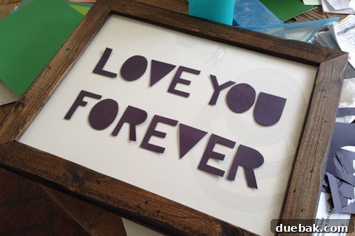 A Burst of Green Joy for the Nursery Closet 12 DIY 'Love You Forever' lettering cut from black construction paper on foam core
