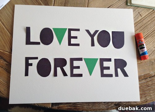 A Burst of Green Joy for the Nursery Closet 13 Finished DIY 'Love You Forever' art with colorful accents on the 'V's, hanging in the nursery