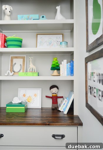 A Burst of Green Joy for the Nursery Closet 15 Close-up of the built-in drawers with wood frames and dark hardware
