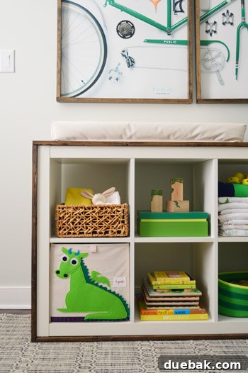 A Burst of Green Joy for the Nursery Closet 16 Wider view of the nursery showing the built-ins, art, and overall balanced decor