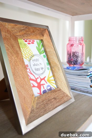 Motivational art card on office shelf