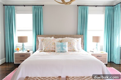 Master bedroom with elegant bedding and nightstands