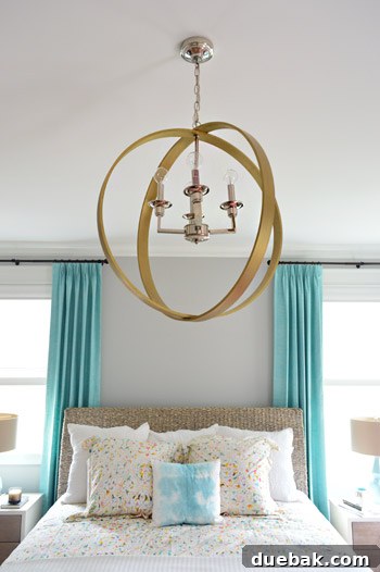 Close-up of wood ring chandelier in master bedroom