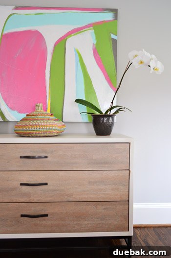 Master bedroom dresser styled with plants and baskets