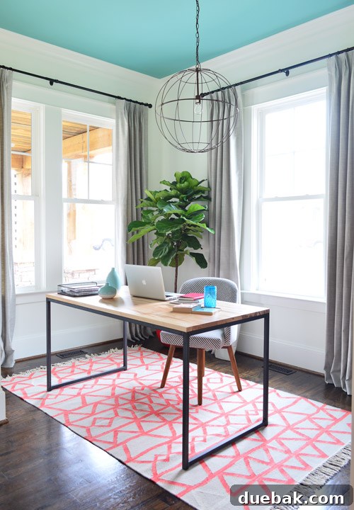 Spacious home office with double doors open and elegant decor