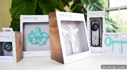 Close-up of various Young House Love product packaging, showing the thoughtful design and branding.