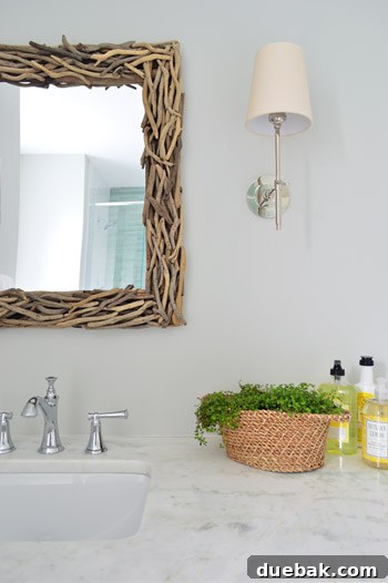 Driftwood framed mirrors enhancing bathroom contrast