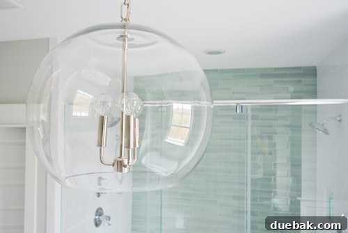 Clear Glass Chandelier as main bathroom lighting