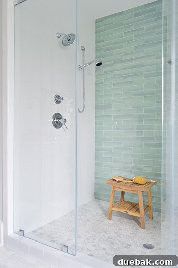 Double shower with white subway tiles and Baliza showerheads