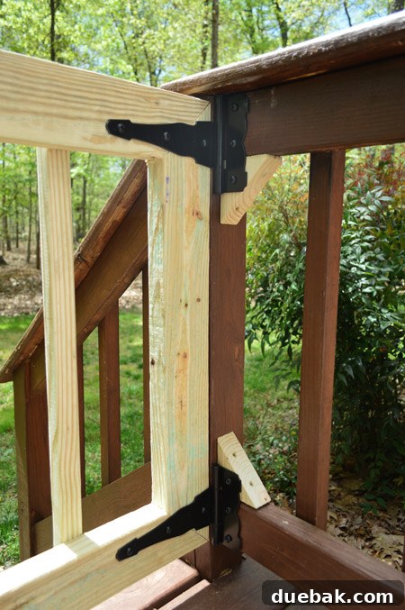 Blocks Of Scrap Wood Added To Railing To Give Secure Place to Add Hinges For Corner Gate