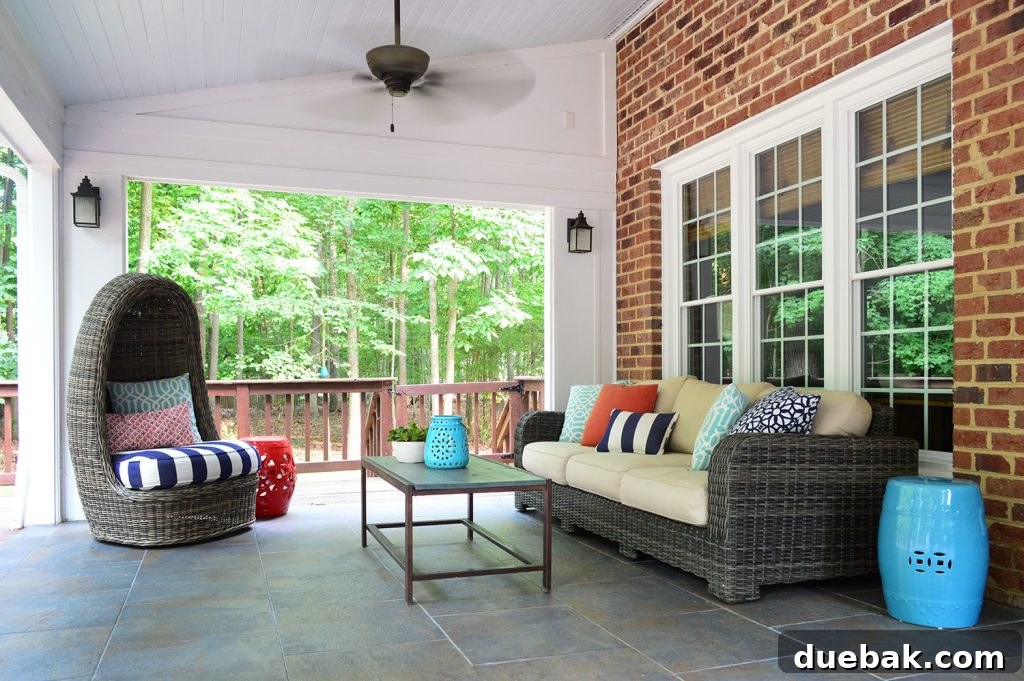 Covered sunroom patio with stained deck gate in background blending with deck