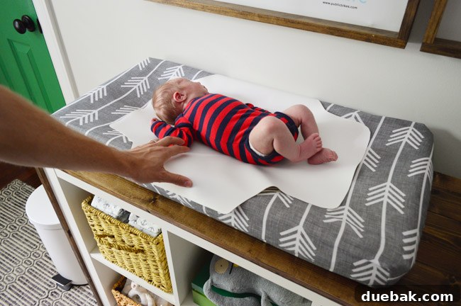 Teddy posing on the new waterproof changing pad