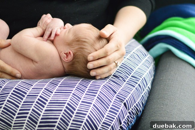 Close-up of baby Teddy on Boppy