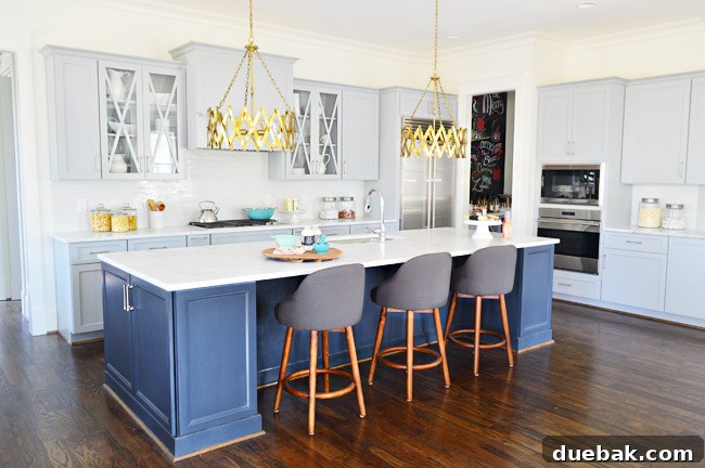 Kitchen Island with Stools, Pendant Lights, and Appliances