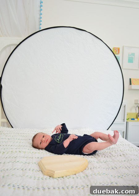 A candid shot of Teddy during a photoshoot, likely with Clara or John in the background.