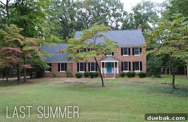 Front View Of Brick Colonial Home Yard With Patchy Grass From Last Summer